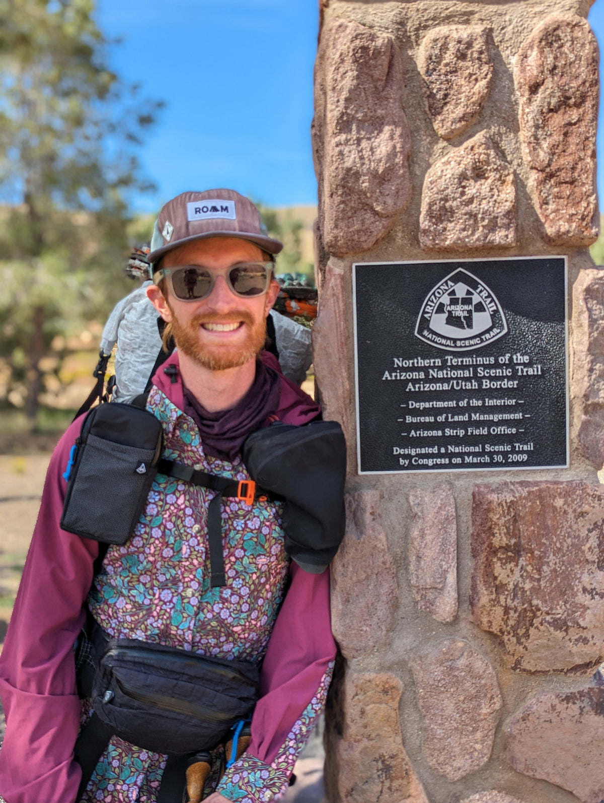 standing next to the marker