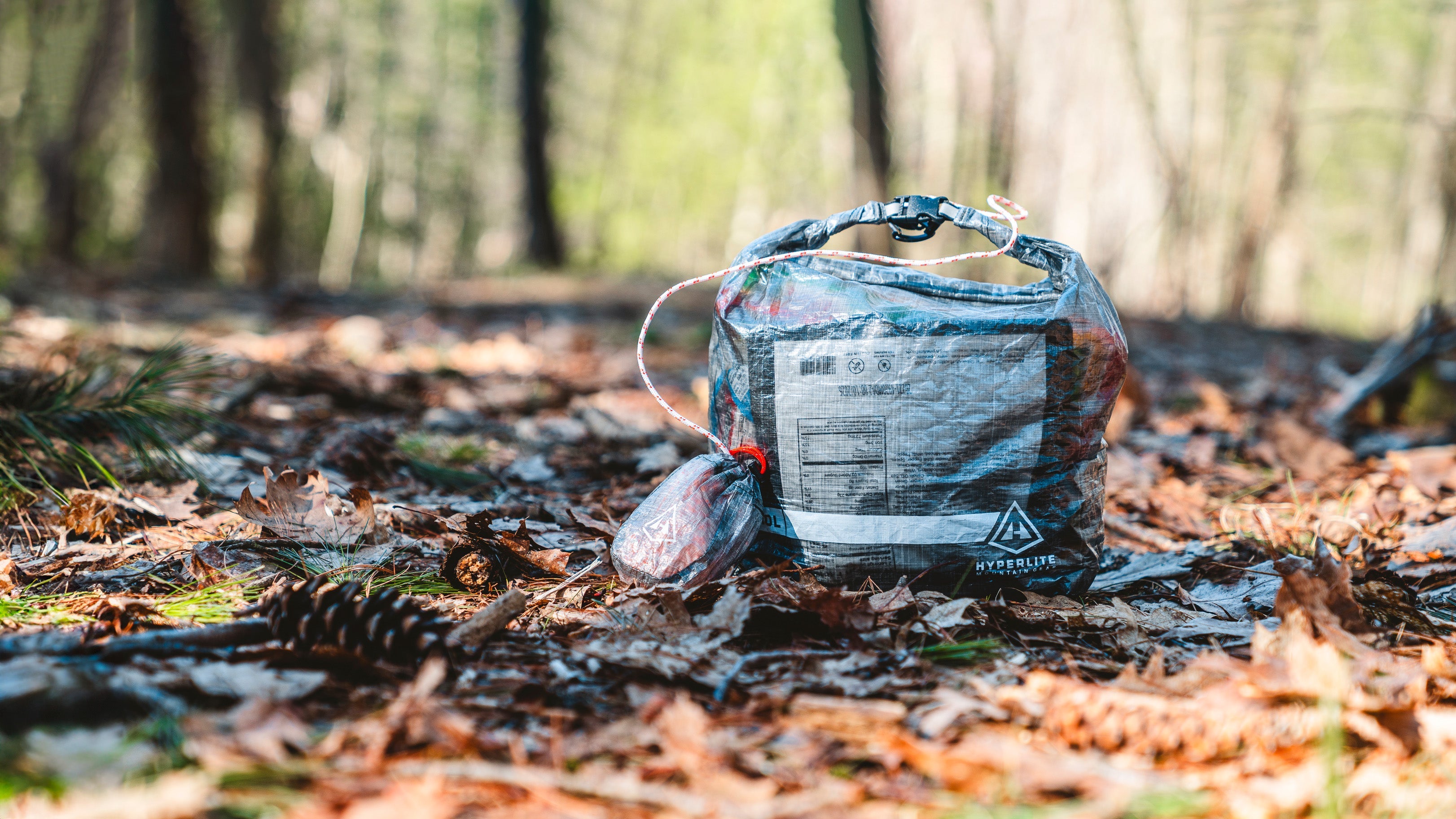 10L Roll-Top Food Bag Kit by Hyperlite Mountain Gear sitting on the forest floor